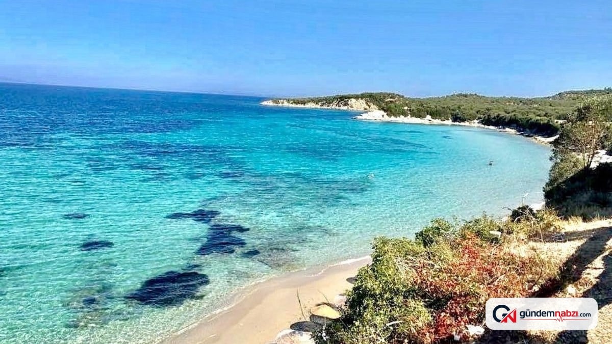 Cam gibi deniziyle Bademli plajı yaz tatilinin gözdesi oldu